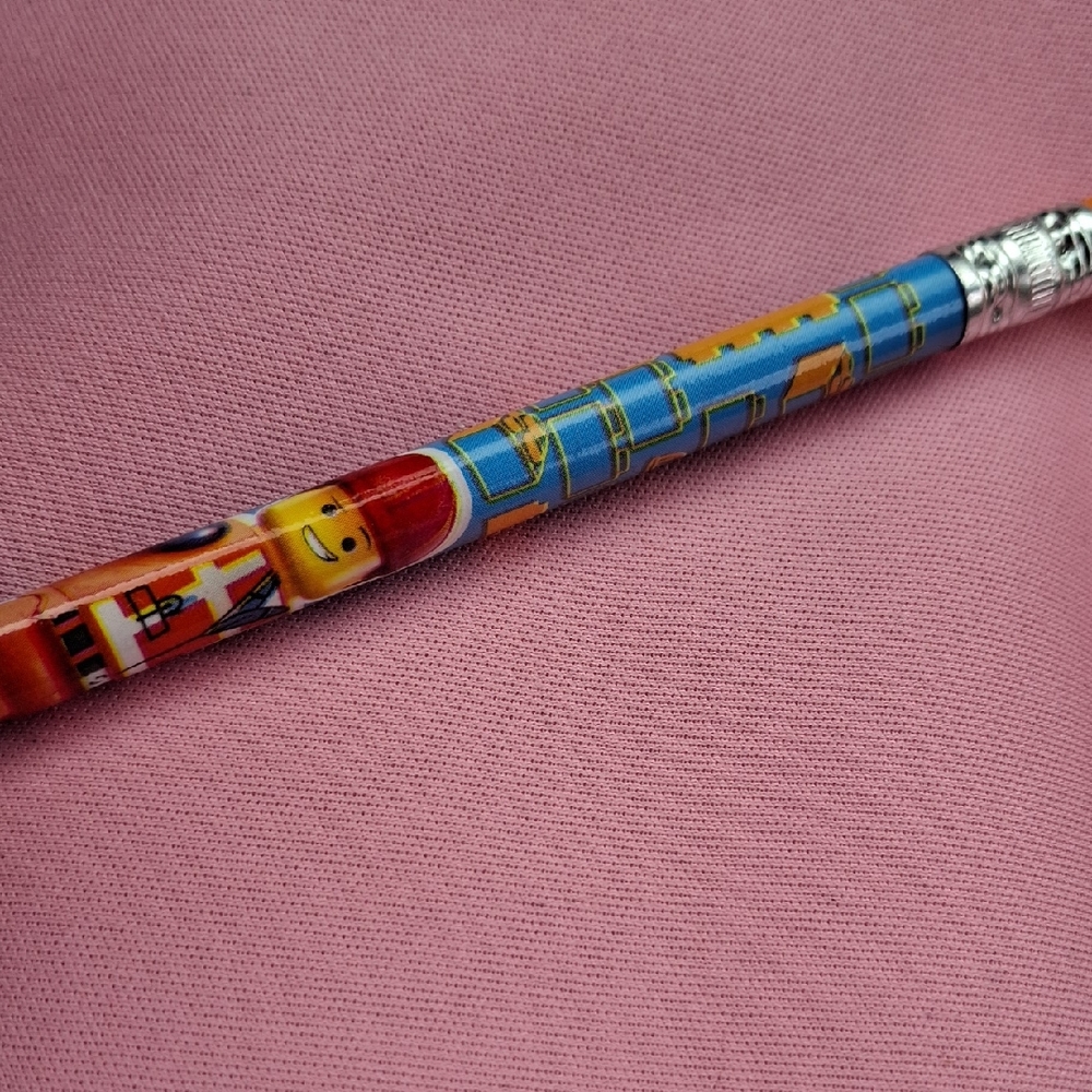 Lego Yellow & Blue Minifigure Pencil with Pink Background